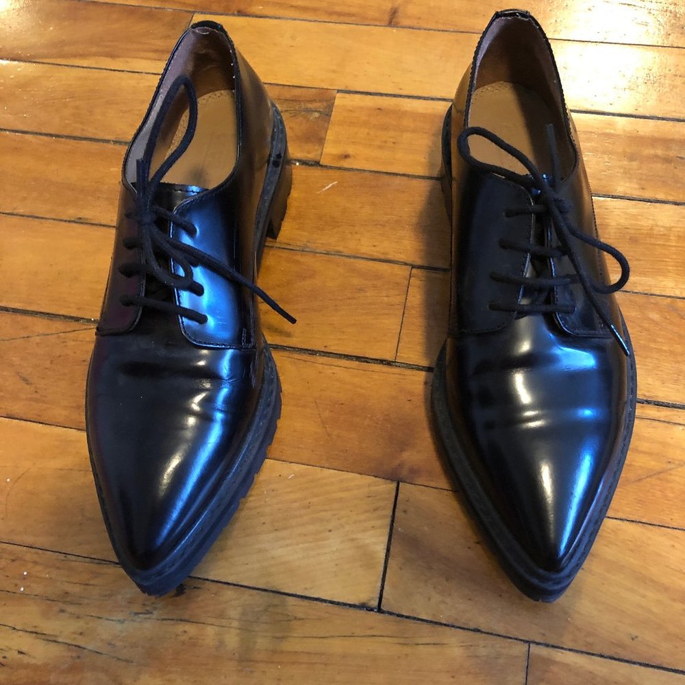 Black pointy-toe oxfords